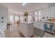 Bright, spacious kitchen with white cabinets, island, stainless steel appliances, and a breakfast nook at 1351 Mckendree Park Ct, Lawrenceville, GA 30043