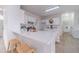 Kitchen featuring white cabinets, countertops, eat-in bar area with seating, and stainless appliances at 1351 Mckendree Park Ct, Lawrenceville, GA 30043