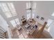 Bright, open living room with soaring ceilings, large windows, fireplace, and stylish furniture at 1351 Mckendree Park Ct, Lawrenceville, GA 30043