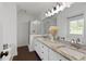 Bathroom with double granite vanity, tub and glass enclosed shower at 5570 Rolling Oaks Dr, Cumming, GA 30040