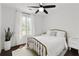 Comfortable bedroom with plush bed, neutral color palette, and natural light at 5570 Rolling Oaks Dr, Cumming, GA 30040