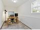 Bright home office with ample desk space, comfortable chair, and natural light at 5570 Rolling Oaks Dr, Cumming, GA 30040