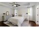 Cozy main bedroom with plush carpet, ensuite bath and neutral decor at 5570 Rolling Oaks Dr, Cumming, GA 30040