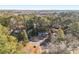 Aerial view of the house surrounded by lush green trees in a quiet neighborhood at 6615 Buckhurst Trl, Atlanta, GA 30349