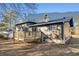 A beautifully maintained backyard featuring a wooden deck and lush greenery at 6615 Buckhurst Trl, Atlanta, GA 30349