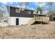 A spacious backyard with a wooden deck and access door offering endless possibilities at 6615 Buckhurst Trl, Atlanta, GA 30349
