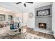 Bright living room featuring a fireplace, modern furniture, and hardwood floors at 6615 Buckhurst Trl, Atlanta, GA 30349