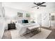 Beautiful primary bedroom with carpet flooring, a ceiling fan, and lots of natural light at 6615 Buckhurst Trl, Atlanta, GA 30349