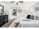Spacious primary bedroom with a comfortable bed, soft carpet, and plenty of natural light at 6615 Buckhurst Trl, Atlanta, GA 30349