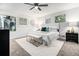 Cozy primary bedroom with a ceiling fan, soft carpet, and lots of natural light at 6615 Buckhurst Trl, Atlanta, GA 30349