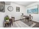 Stylish home office featuring modern décor, including an art piece, area rug, and a sleek desk at 6615 Buckhurst Trl, Atlanta, GA 30349