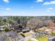 Bird's-eye view of a home nestled among tall trees and blue skies at 8329 Marlborough Dr, Jonesboro, GA 30238