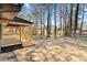 A spacious backyard area featuring a newly built wooden porch and open yard space at 8329 Marlborough Dr, Jonesboro, GA 30238