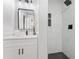 Modern bathroom with black fixtures, honeycomb tile shower floor and stylish vanity mirror at 8329 Marlborough Dr, Jonesboro, GA 30238