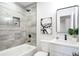 Bathroom featuring a tub, updated vanity, and shower with gray tile and modern fixtures at 8329 Marlborough Dr, Jonesboro, GA 30238