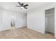 Spacious bedroom featuring wood flooring and a ceiling fan, with a bathroom and closet visible at 8329 Marlborough Dr, Jonesboro, GA 30238