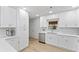 Charming kitchen with white cabinetry, modern appliances, and ample counter space at 8329 Marlborough Dr, Jonesboro, GA 30238