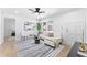 Bright and airy living room area with light walls, hardwood floors, and nice natural lighting at 8329 Marlborough Dr, Jonesboro, GA 30238