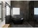 Chic bathroom with a soaking tub, heated towel rack, and a glass-enclosed shower at 1041 Walker Se Ave, Atlanta, GA 30316