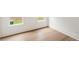 Sunlit bedroom with wood floors, white trim, and bright windows at 1041 Walker Se Ave, Atlanta, GA 30316
