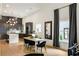 Modern kitchen seamlessly flowing into the dining area, featuring dark cabinets and a bright island at 1041 Walker Se Ave, Atlanta, GA 30316