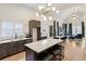 Stunning kitchen with dark wood cabinetry, stainless appliances, and an island with marble countertop at 1041 Walker Se Ave, Atlanta, GA 30316