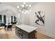 Bright kitchen with hardwood floors, pendant lighting, and modern appliances; dining area in view at 1041 Walker Se Ave, Atlanta, GA 30316
