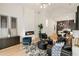 Elegant living room with a fireplace, stylish decor, and seamless flow to the kitchen and dining area at 1041 Walker Se Ave, Atlanta, GA 30316