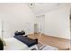 Bright main bedroom with hardwood floors, a bench and multiple closets at 1041 Walker Se Ave, Atlanta, GA 30316