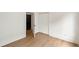 Bright room featuring wood floors, white trim, closet, and an open doorway at 1041 Walker Se Ave, Atlanta, GA 30316