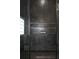 Sleek shower featuring dark slate tile, a built-in niche, and sophisticated design elements at 1041 Walker Se Ave, Atlanta, GA 30316