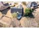 Aerial view of a house with a deck and a yard, surrounded by nature at 105 Condor Ct, Woodstock, GA 30188