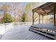 Charming outdoor deck features a shaded pergola, ideal for entertaining or quiet relaxation at 105 Condor Ct, Woodstock, GA 30188