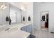 Bathroom with double vanity, framed mirror, and walk-in closet at 105 Condor Ct, Woodstock, GA 30188
