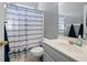 Bathroom with a single vanity, toilet, and a shower/tub combo at 105 Condor Ct, Woodstock, GA 30188