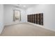Bright bedroom featuring carpeted floors and a window providing ample natural light at 105 Condor Ct, Woodstock, GA 30188