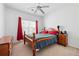 Cozy bedroom with carpet flooring, ceiling fan and a window at 105 Condor Ct, Woodstock, GA 30188