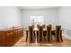 Formal dining room featuring hardwood floors, wainscotting, and natural light at 105 Condor Ct, Woodstock, GA 30188