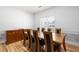 Formal dining room featuring hardwood floors, wainscotting, and natural light at 105 Condor Ct, Woodstock, GA 30188