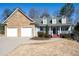Charming single-Gathering home features a stone facade and attached two-car garage at 105 Condor Ct, Woodstock, GA 30188