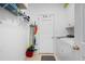 Clean, well-organized laundry room with washer, dryer, and shelving at 105 Condor Ct, Woodstock, GA 30188