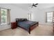 Spacious main bedroom with carpet flooring, ceiling fan and large windows at 105 Condor Ct, Woodstock, GA 30188