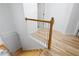 Bright staircase features hardwood steps and classic white banister, leading to the upper level at 105 Condor Ct, Woodstock, GA 30188