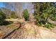 Large yard with mature trees, shrubs and professional landscaping at 105 Condor Ct, Woodstock, GA 30188