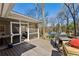 Outdoor deck features a grill and seating area with steps leading down to the backyard at 1135 Norwich Ne Cir, Atlanta, GA 30324