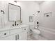 Modern bathroom with white subway tile, marble floors, white vanity, black hardware, and a shower-tub combo at 2860 3Rd Sw Ave, Atlanta, GA 30315