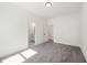 Bedroom showcasing neutral walls, plush gray carpet, and an adjacent bathroom at 2860 3Rd Sw Ave, Atlanta, GA 30315
