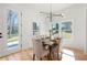 Dining area featuring a modern light fixture, wood floors, and natural light at 2860 3Rd Sw Ave, Atlanta, GA 30315