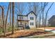 Two-story modern farmhouse with white siding, black trim and a view of the long concrete driveway at 2860 3Rd Sw Ave, Atlanta, GA 30315