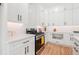 Bright kitchen with white cabinets, stainless steel range, and quartz countertops at 2860 3Rd Sw Ave, Atlanta, GA 30315